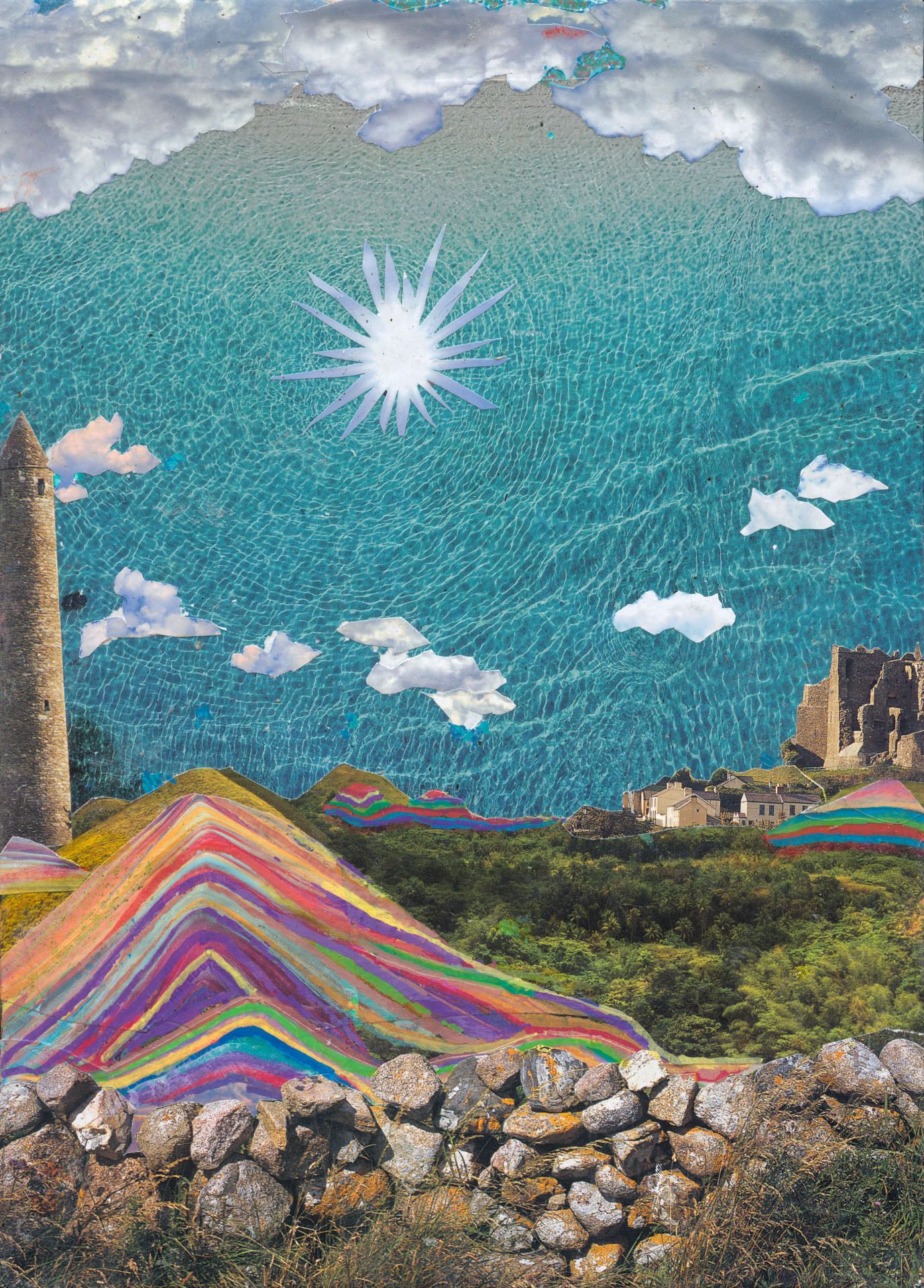 Rainbow colored mountains made of layered paper textures under a blue sky with a bright sun, adjacent to a stone tower and ruins.